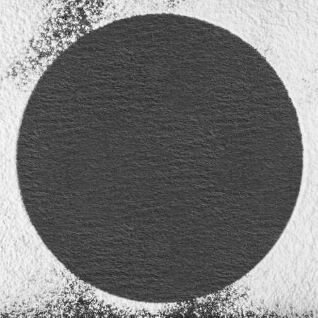 Circle frame of scattered flour black circle in the center may use as background or texture.の写真素材
