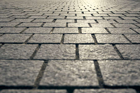 Abstract background - gray paving slabs in the form of squares.