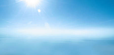 Horizontal shot of sea background. White blue background of ocean and sky in the bright sunlight.の写真素材