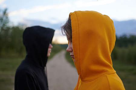 Two teenagers outdoors. Youth fashion. Problems of transitional age. The guy in blur.の写真素材