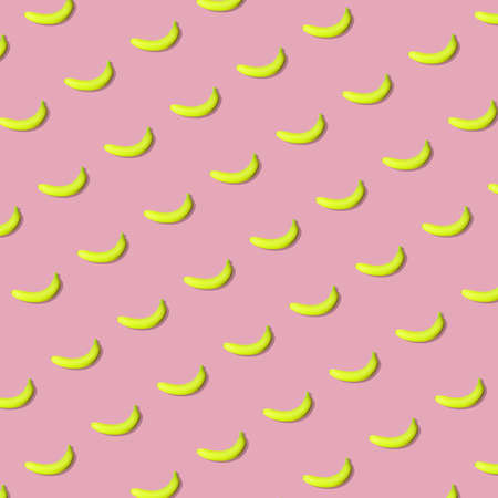Colorful fruit pattern of fresh yellow bananas on pink background. From top viewの写真素材
