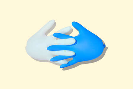 Inflated medical gloves. A pair of protective gloves with interlocked fingers. Latex blue and white...