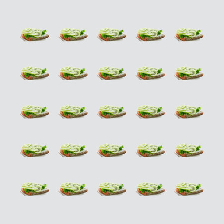Square pattern of sandwiches with kiwi and soft cheese on a white background. Modern minimal food photography collage. Morning breakfast concept.の写真素材