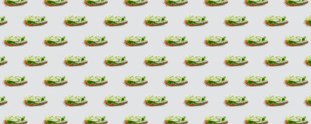 Horizontal banner of seamless pattern of sandwiches with kiwi and soft cheese on a white background. Modern minimal food photography collage. Morning breakfast concept.の写真素材