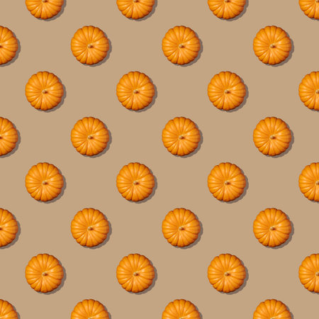 Square seamless pattern of pumpkin on beige background. Autumn pumpkin background. Top view.の写真素材