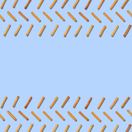 Square seamless pattern of cookie sticks isolated on blue background. Seamless pattern with copy space.の写真素材