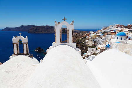 Beautiful view of famous Greek churches in the mediterranean island of Santorini.の写真素材