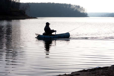 Fishing in the boat on the sunset in Ruza october 2010
