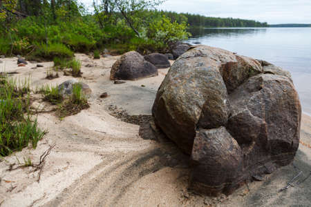 Nature of Russia. The Republic of Karelia. Islands on the horizon. Wild nature. Calm on the lake. Chirka-Kem river.の写真素材