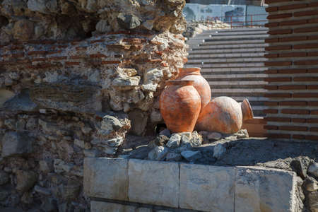 Amphorae on the backdrop of a stone wall. Nessebar. Bulgaria.の写真素材