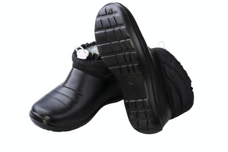 Black rubber female shoes isolated on white background