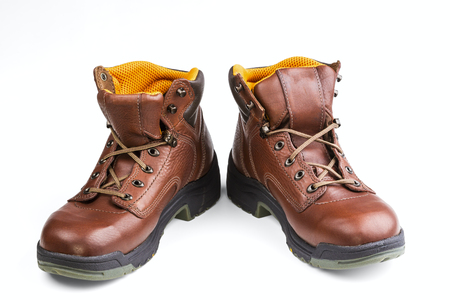 brown men's boots isolated on white backgroundの写真素材