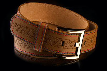 new stylish brown leather men's belt on mirror backgroundの写真素材