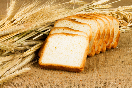 fresh white bread on sackcloth background