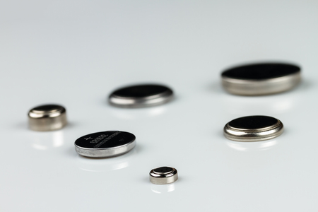 set of lithium button cell batteries on white backgroundの写真素材