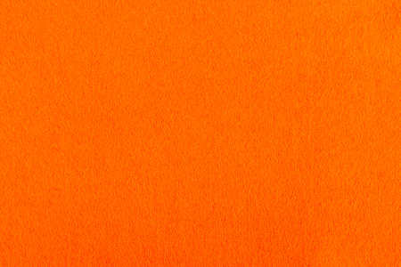 background of colored (orange) felt for creativity and designの写真素材