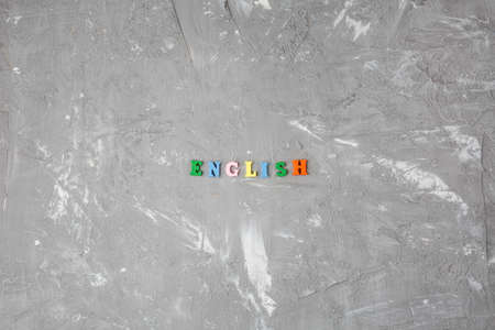 inscription English from colored wooden letters on a gray background, English Language Dayの写真素材