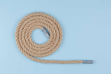 rope on a blue background, a katana twisted on a table
