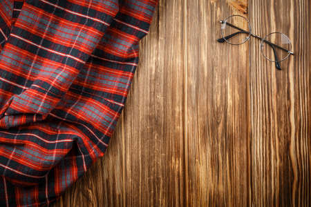 Blank space with round glasses on wooden background. Top view. workplace at the cozy wooden table...