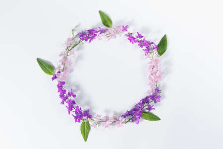 Flowers composition. Wreath made of various colorful flowers on white background. Easter, spring,...
