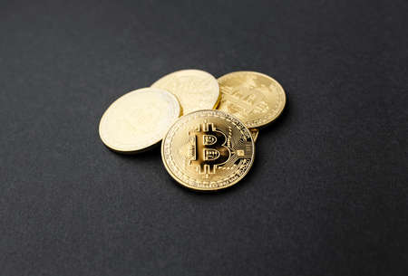 bitcoin on a black background, coin bitcoin on the table, a lot of free space
