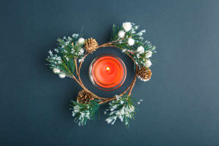 Christmas and New Year background with gifts, deer, stars and fir-trees, flat lay on a dark blue background, holiday greetings, concept of a winter background with free spaceの写真素材