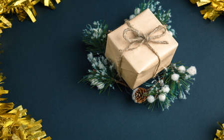 Christmas and New Year background with gifts, deer, stars and fir-trees, flat lay on a dark blue...
