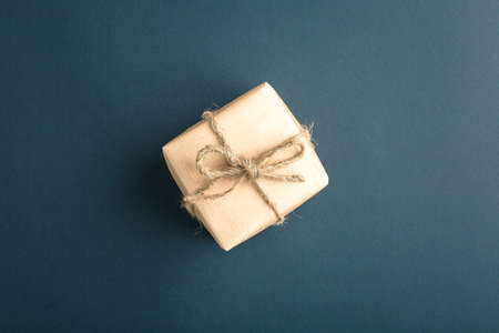 gift on a dark background, top view on a gift box, flat layの写真素材