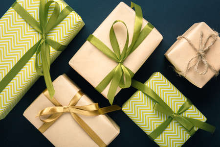 gifts on a dark background lined, top view on a gift box, flat layの写真素材