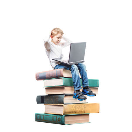 boy sitting on books with laptop isolated on white background, International Children's Book Day