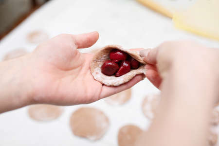 home vareniki, cook at home delicious chocolate vareniki with cherriesの写真素材