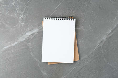 School notebook on the marble table top view.
business concept