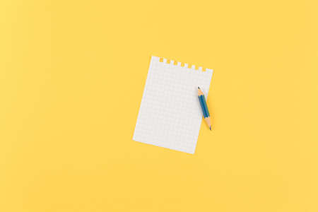 small empty sheet of paper on a yellow isolated background, top view and lots of free space. flat...