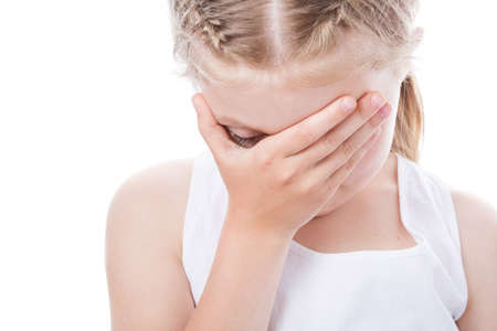 little girl with tears in her eyes isolated on white background, the child is crying, the concept of...