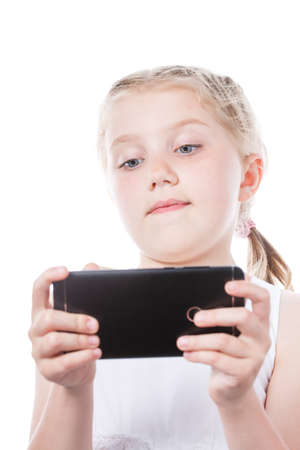 girl teenager correspondence in social networks on the phone, a girl with a phone in her hand makes an order onlineの写真素材