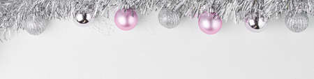 Garland with silver balls decorations top view on a white background Christmas concept a lot of free space. Flat layの写真素材