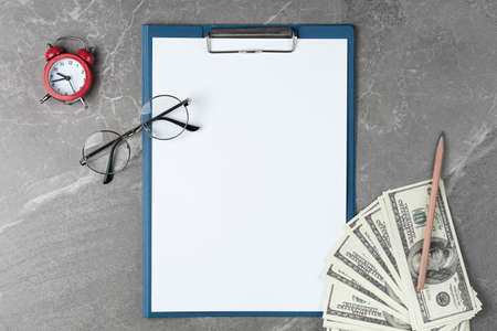 open notepad with money on the marble table top view,
business conceptの写真素材