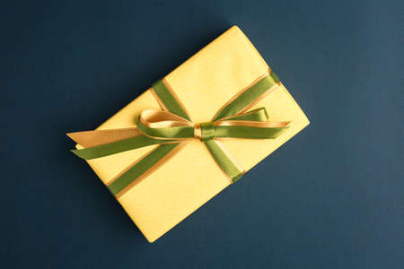 gift on a dark background, top view on a gift box, flat lay
