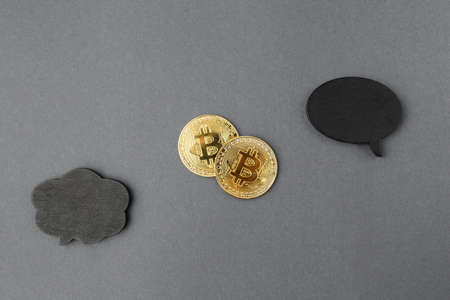 bitcoin on a gray background, coin bitcoin on the table, a lot of free space
