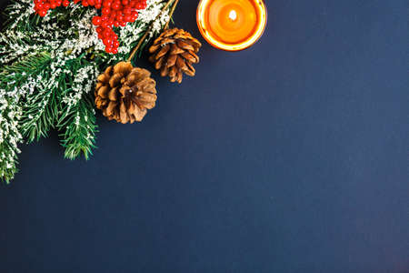 Christmas and New Year background with gifts, deer, stars and fir-trees, flat lay on a dark blue background, holiday greetings, concept of a winter background with free spaceの写真素材