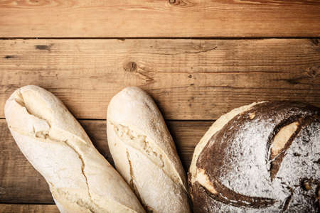 bread on the table, homemade bread with flour and grain on a wooden background