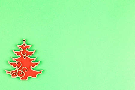 Toy tree on green background. christmas concept. new year composition