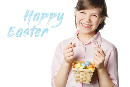 Happy Easter girl with easter eggs in hands isolated on white background looking at camera and...