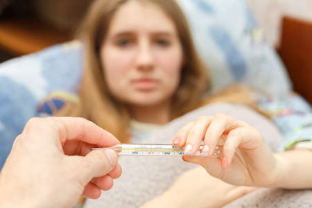 child is measured by the temperature of a thermometer, a cold and the flu is at home with a high...