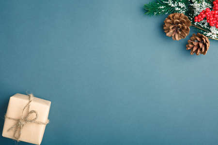Christmas and New Year background with gifts, deer, stars and fir-trees, flat lay on a dark blue...