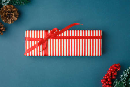 Christmas and New Year background with gifts, deer, stars and fir-trees, flat lay on a dark blue background, holiday greetings, concept of a winter background with free spaceの写真素材