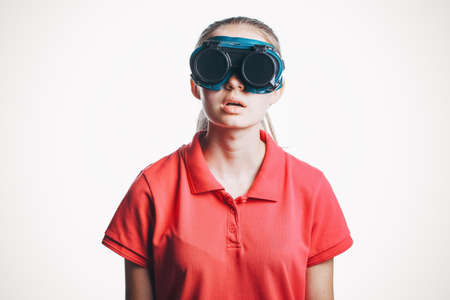 surprised girl in virtual reality glasses playing, Kid with toy virtual reality headset, photo isolated on white backgroundの写真素材
