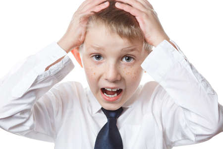 sad boy on white isolated background, schoolboy in school uniform, sad child