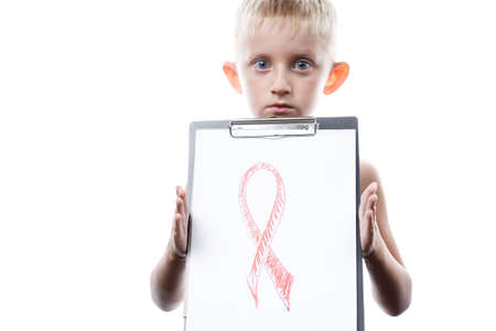 little boy holding a tablet with a red ribbon symbol combating cancer and AIDS, isolated on a white...