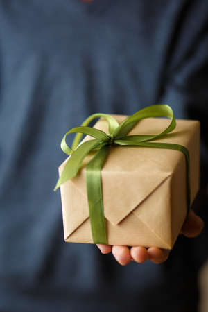 happy child with a gift in his hands, festive mood, Christmas and a birthday present gifts